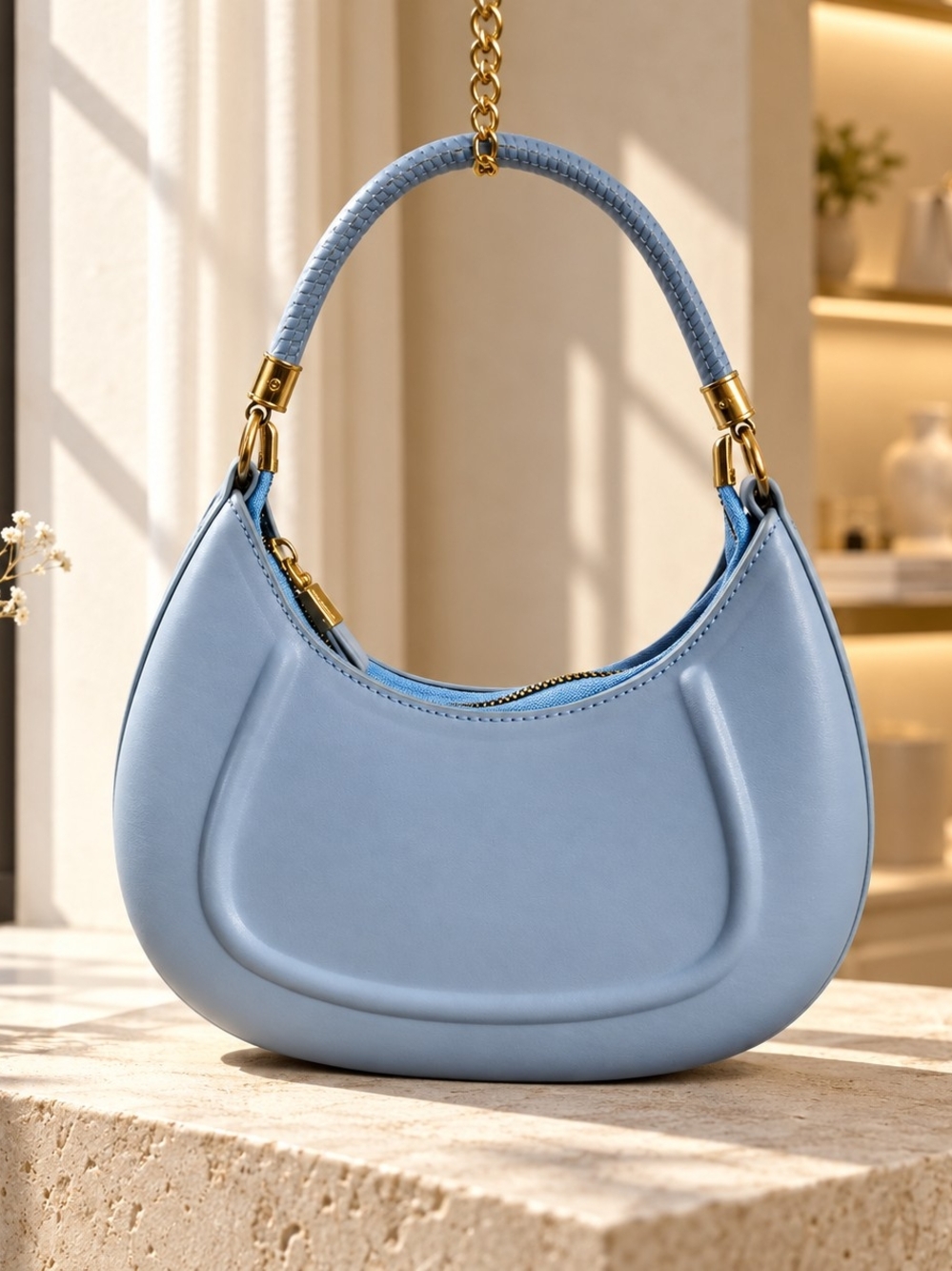 Sky-Blue Crescent Shoulder Bag with Gold Accents
